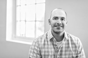 Dan Carlton sitting by Window